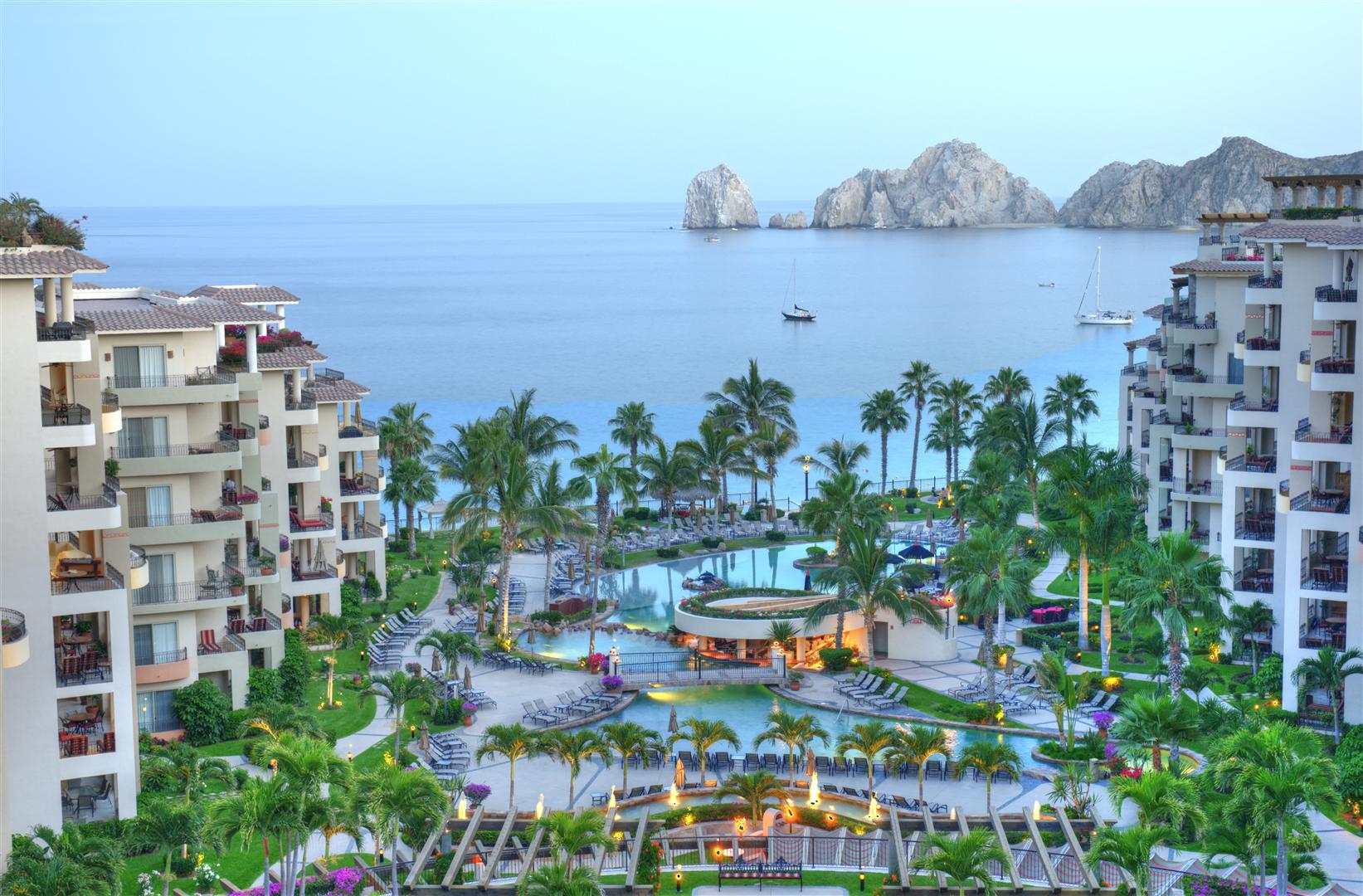 Villa la Estancia pool at dusk with Lands End in the background